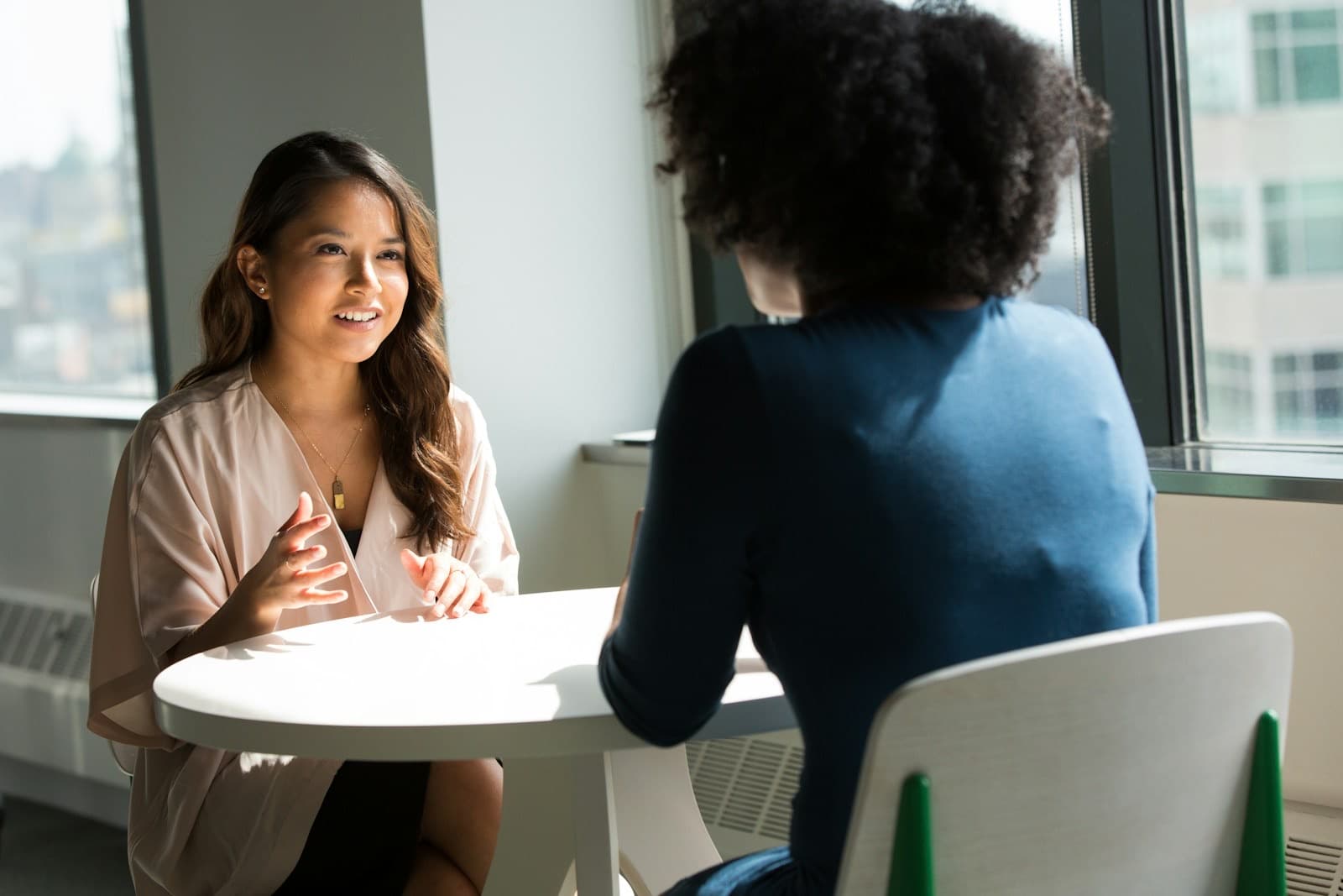 Two people in conversation, interview style