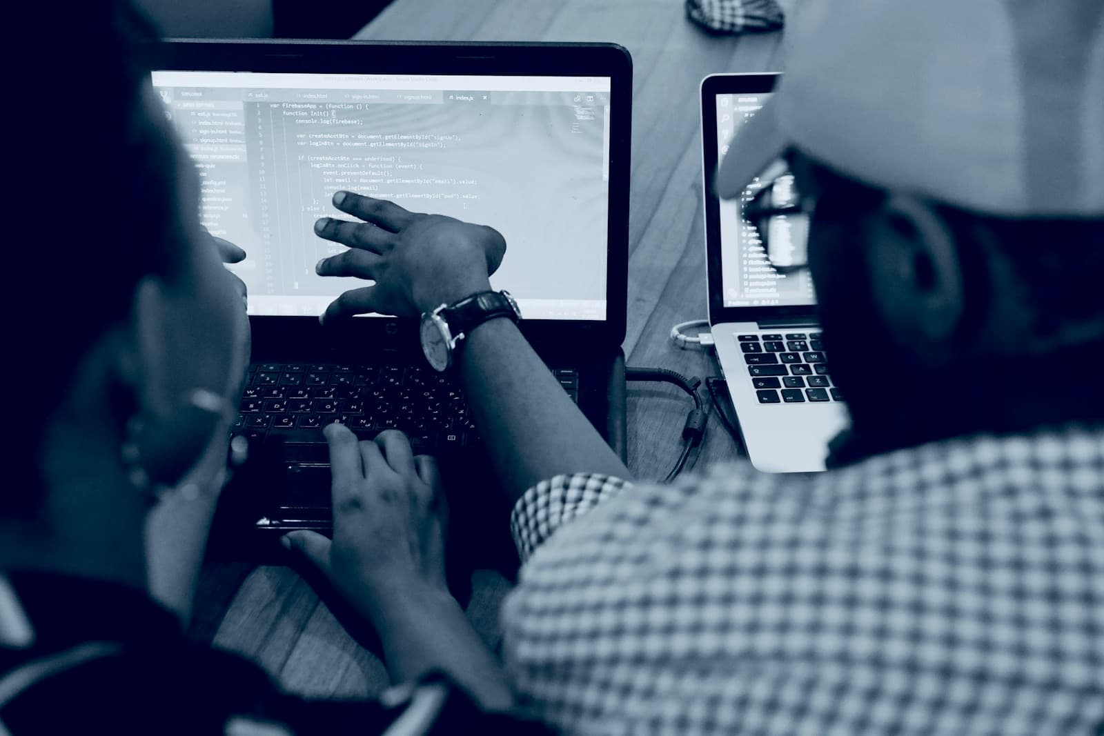 Pair programming session on two laptops